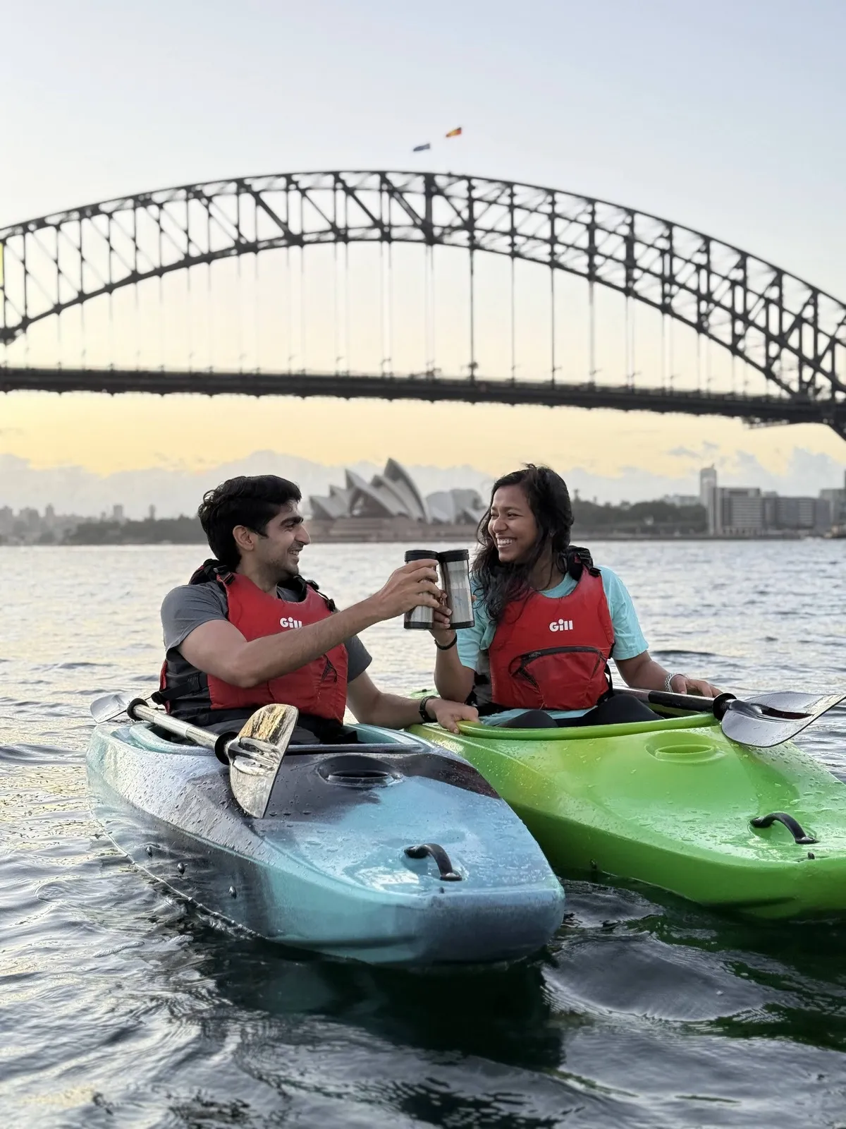 WealthyWithTwo couple kayaking in Australia — building wealth together